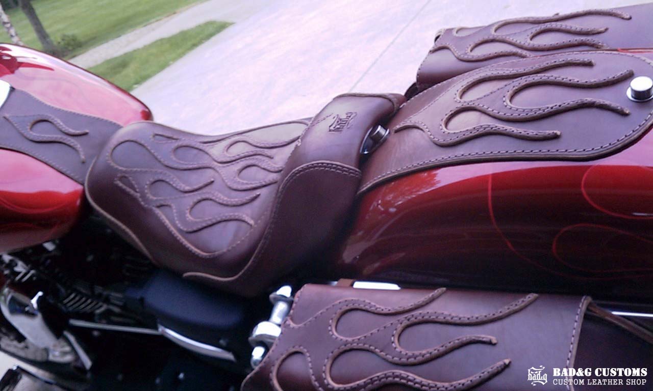BAD&G Customs flame overlay leather seat and saddlebags installed on a Harley-Davidson Dyna