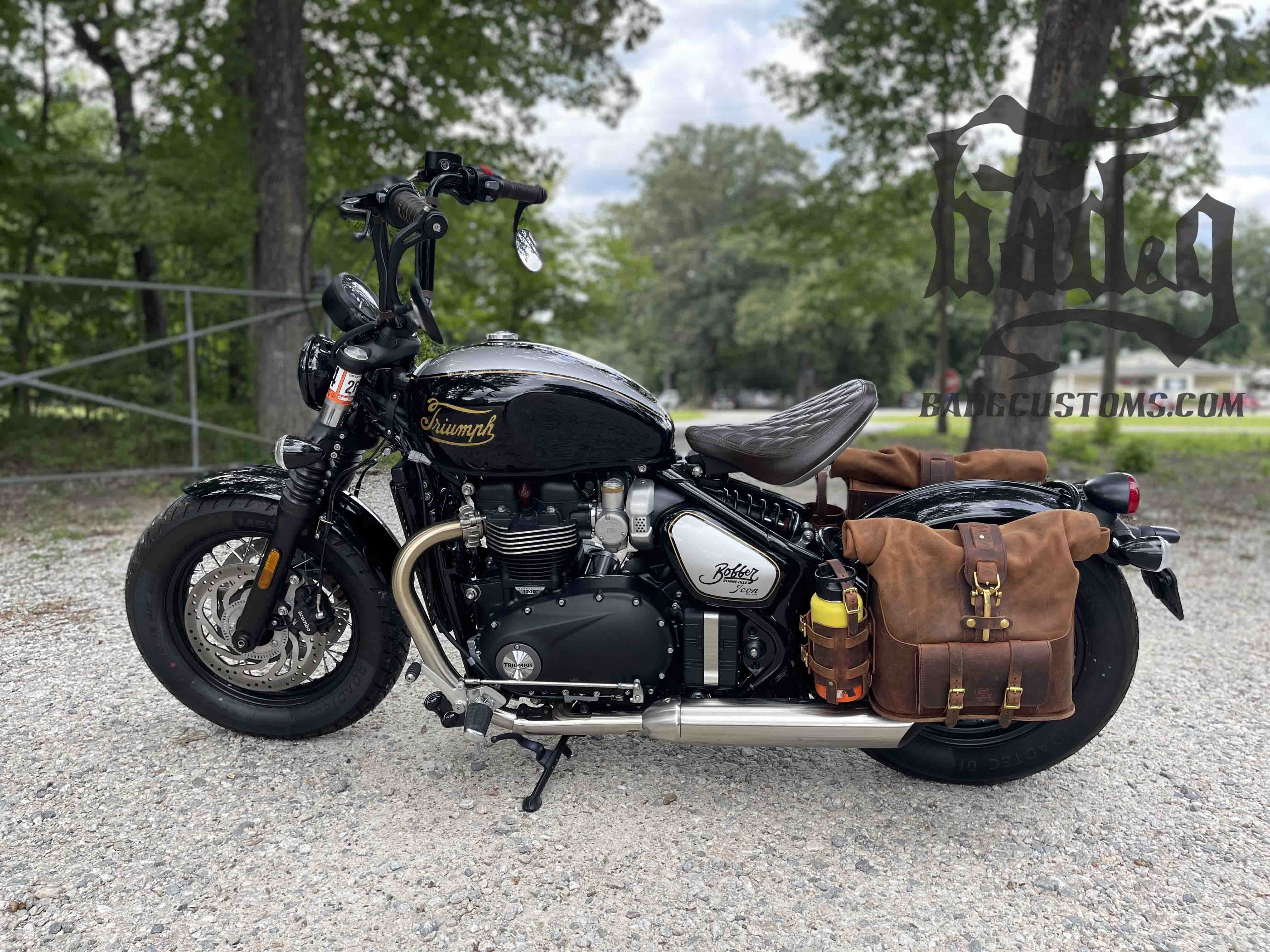 Triumph Bonneville Bobber Panniers Rolltop Swingarm Saddlebags. Hand crafted in USA with premium veg tan water buffalo leather, waterproof liners and solid brass hardware. BAD&G Customs TBP01