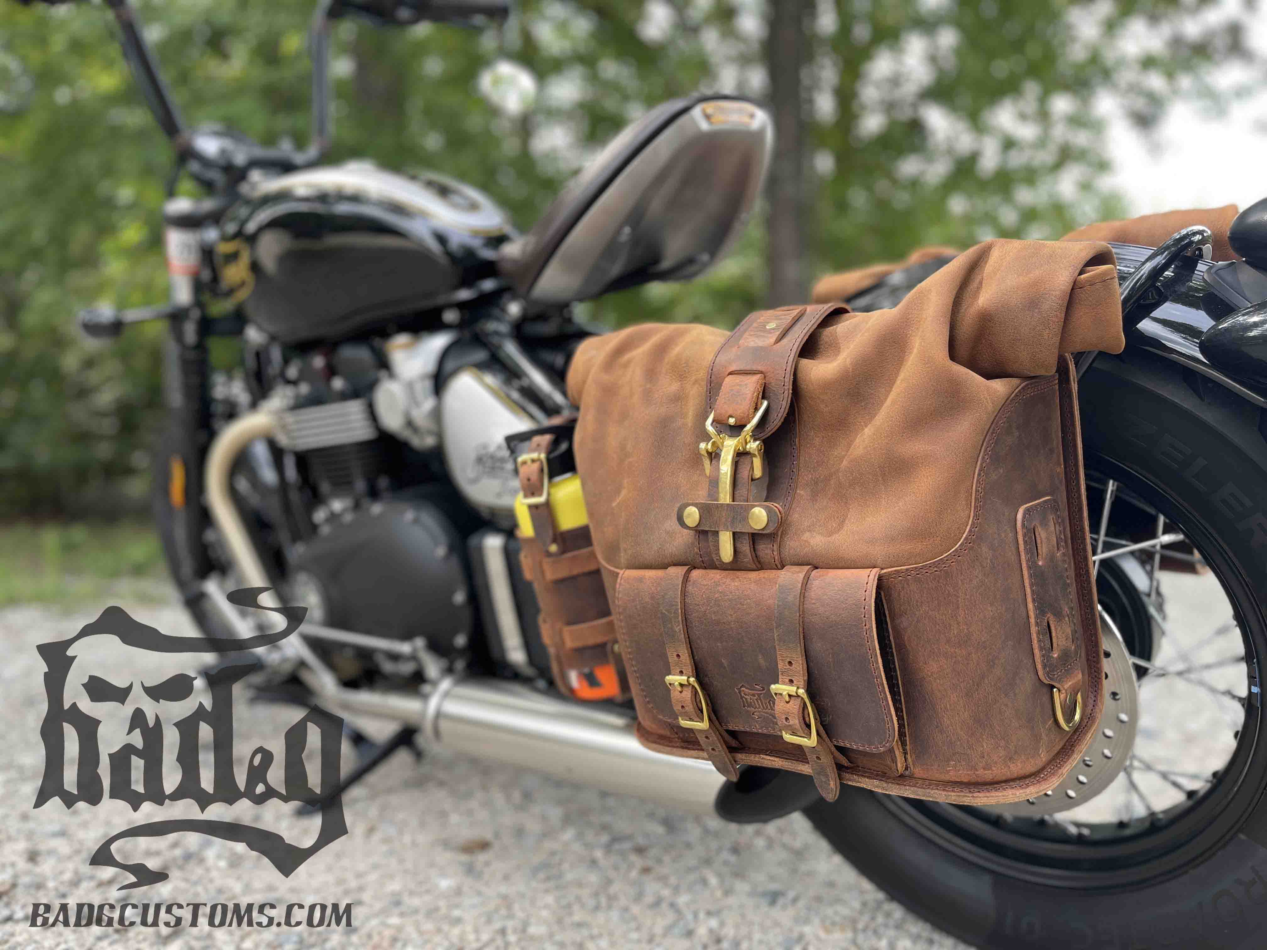 Triumph Bonneville Bobber Panniers Rolltop Swingarm Saddlebags. Hand crafted in USA with premium veg tan water buffalo leather, waterproof liners and solid brass hardware. BAD&G Customs TBP01