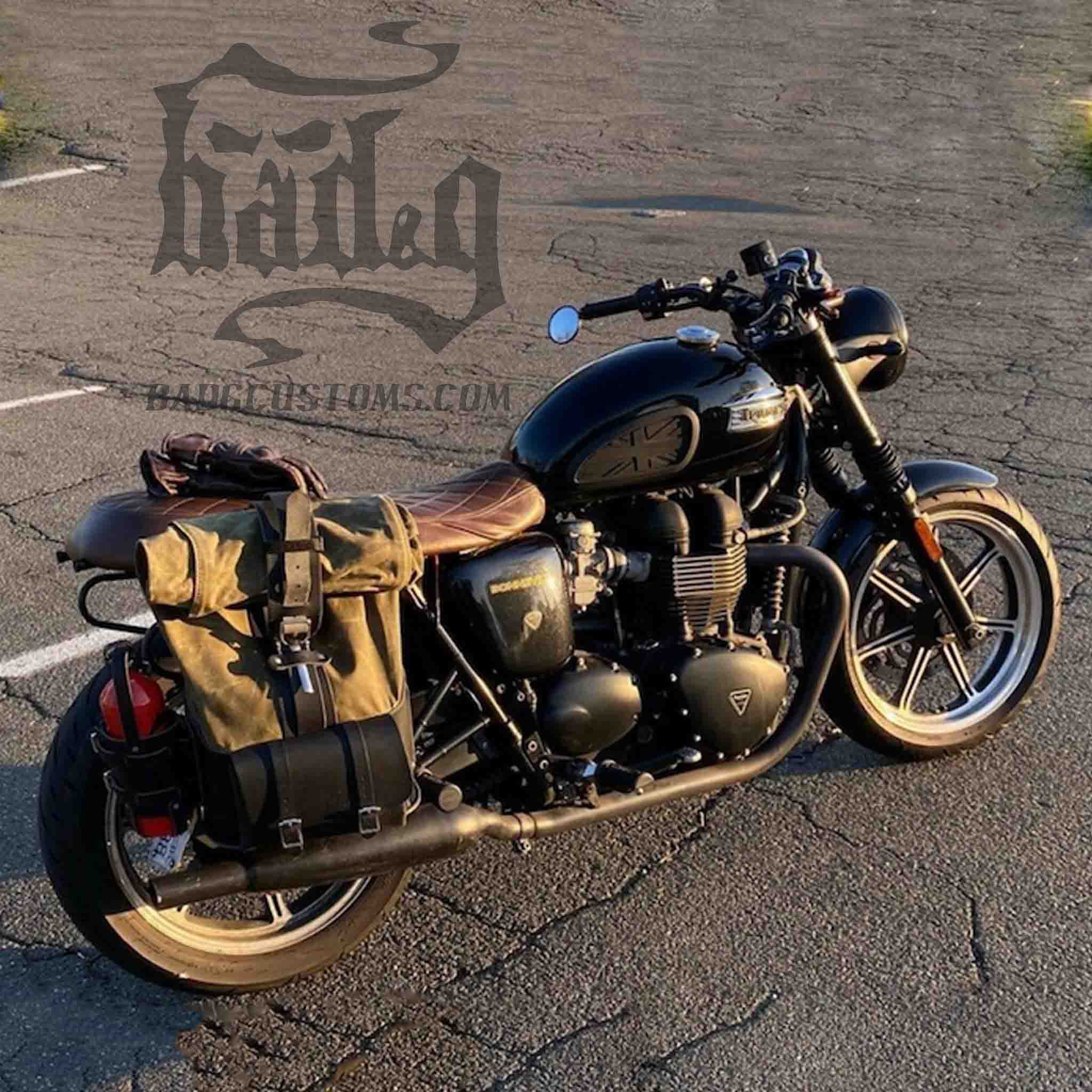 Upgrade your ride with the URB02 Rolltop Backpack Saddlebag. Unique design enables quick conversion from saddlebag to backpack. Hand crafted in USA with premium veg tan water buffalo leather, waxed canvas and stainless steel hardware. Durable and stylish, it's the perfect fit for your motorcycle.