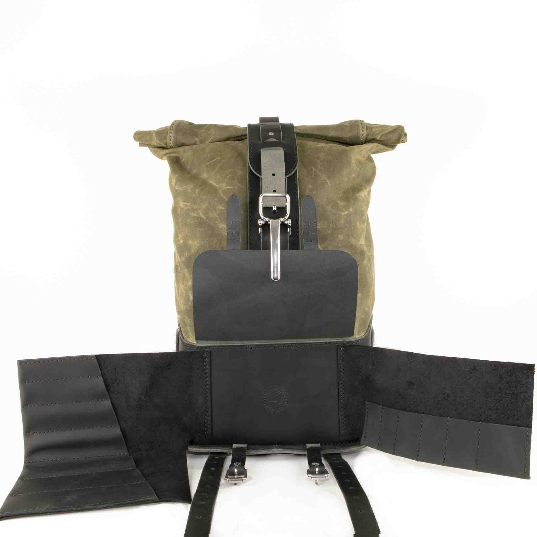 Upgrade your ride with the URB02 Rolltop Backpack Saddlebag. Unique design enables quick conversion from saddlebag to backpack. Hand crafted in USA with premium veg tan water buffalo leather, waxed canvas and stainless steel hardware. Durable and stylish, it's the perfect fit for your motorcycle.